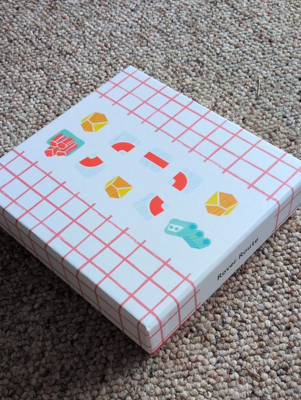 Lovevery Home Game – White with Coral Grid and Multicolor Icons
